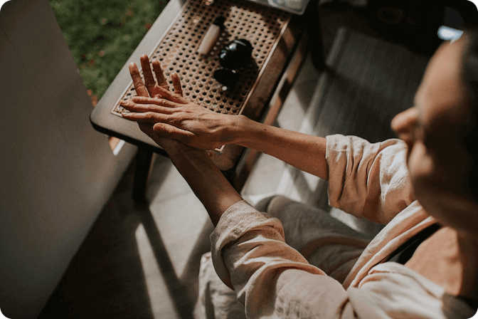 Lady rubbing cream into her hands